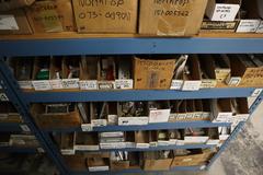 Teardrop Style Racking (2) 4' Sections, (18) Shelves,  with Contents of Mostly Aluminum Fixture Plates with Steel Hardware