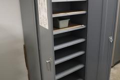 Steel 2 Door Cabinet with 7 Adjustable Shelves and Contents
