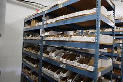 Teardrop Style Racking (2) 4' Sections, (15) Shelves,  with Contents of Mostly Aluminum Fixture Plates with Steel Hardware, And Tooling