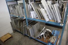 Teardrop Style Racking (2) 4' Sections, (10) Shelves,  with Contents of Mostly Aluminum Fixture Plates with Steel Hardware