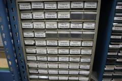 Teardrop Style Adjustable Shelf Racking with 6 Shelves with Assorted Contents of Multi Bin Organizers with Fasteners and Hardware