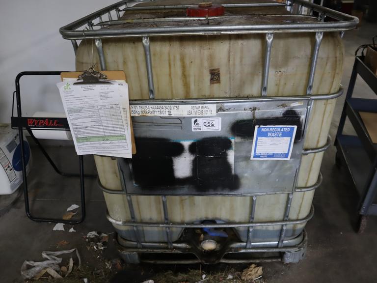 Schutz 300 Gallon Plastic Oil Container with Metal Caging with Small Amount of Fuel Oil